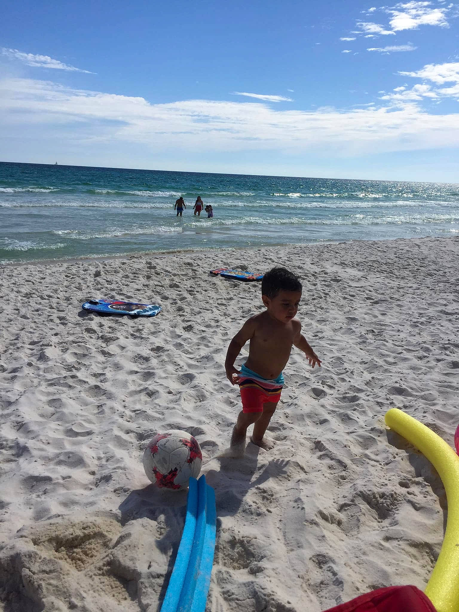 Damian is registered to the contest to win money with this photo: beach, cloud, coast, coastal_and_oceanic_landforms, fun, holiday, leisure, ocean, person, recreation, sand, sea, shore, spring_break, summer, toddler, tourism, vacation, water, wave