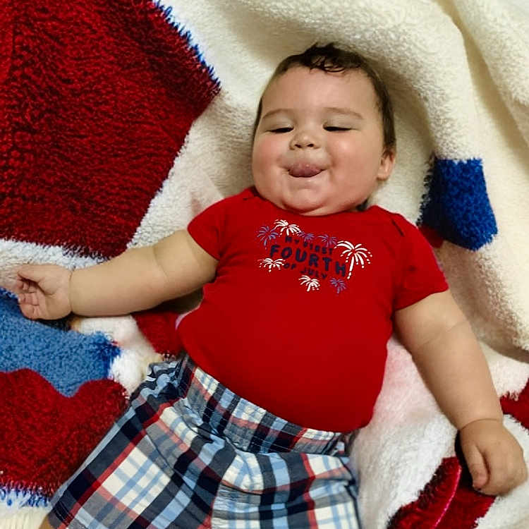 Ollie joined the competition — help win amazing prizes! baby, blanket, bodypart, clothing, cushion, face, finger, furniture, hand, happy, head, homedecor, laughing, pants, person, photography, portrait, shorts, smile, t_shirt