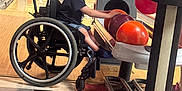 Sawyer is registered to the contest to win money with this photo: activity, adaptive_sports, bowling_alley, bowling_ball, bowling_pins, child, disability, floor_tiles, fun, game, happy, indoor, leisure, person, recreation, shorts, smiling, sports_equipment, tshirt, wheelchair