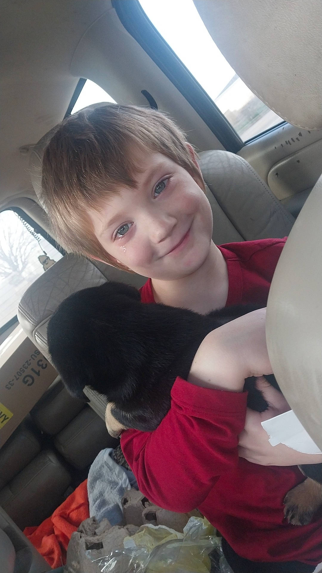 Kyson joined the competition — help win amazing prizes! auto_part, automotive_design, bangs, black_hair, car, car_seat, car_seat_cover, comfort, companion_dog, family_car, fun, hairstyle, head_restraint, human_leg, joy, lap, motor_vehicle, person, smile, steering_wheel