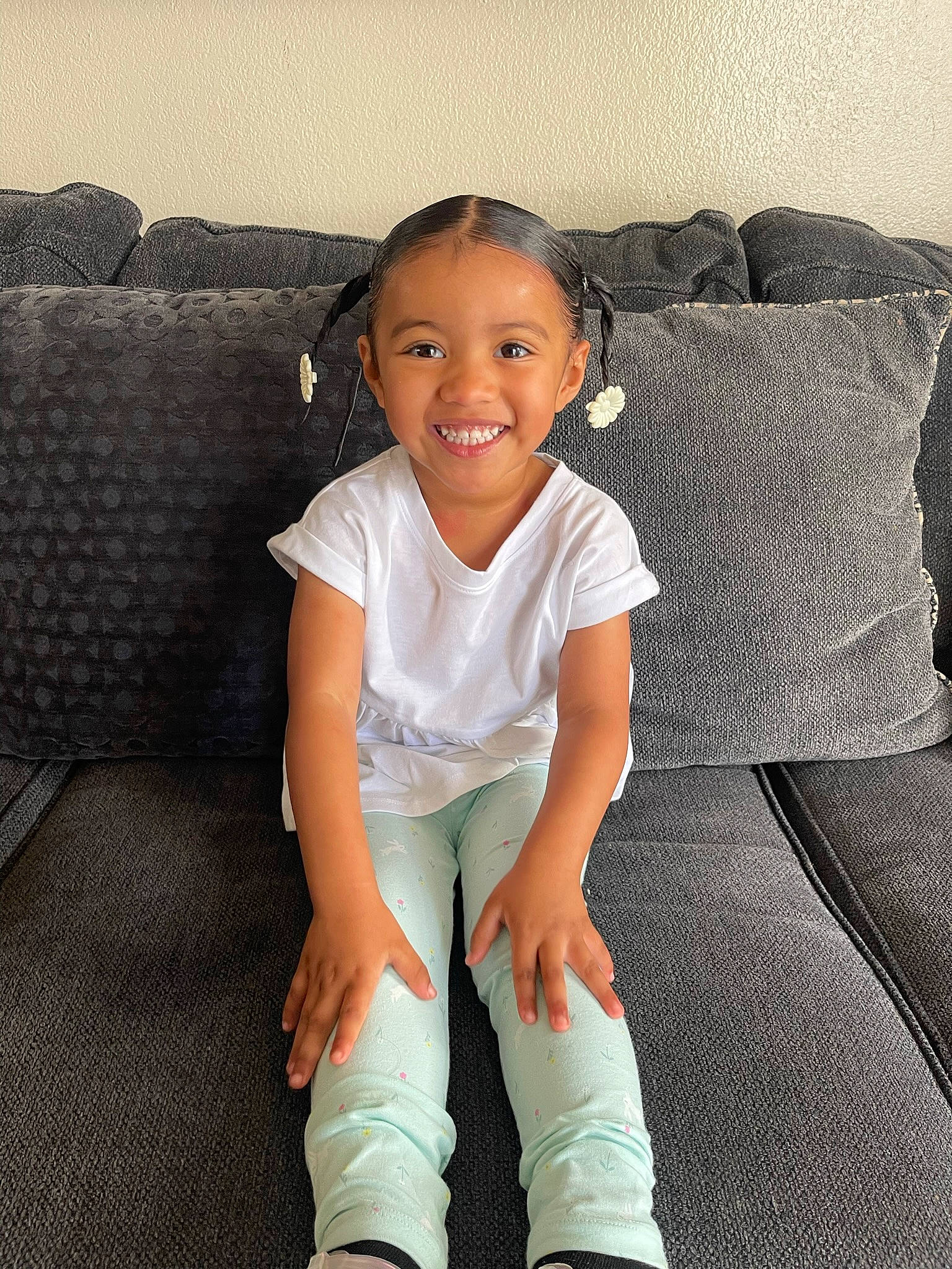 Haley joined the competition — help win amazing prizes! baby_toddler_clothing, comfort, couch, elbow, face, flash_photography, flooring, happy, head, joint, joy, knee, leg, neck, person, skin, sleeve, smile, sock, t_shirt