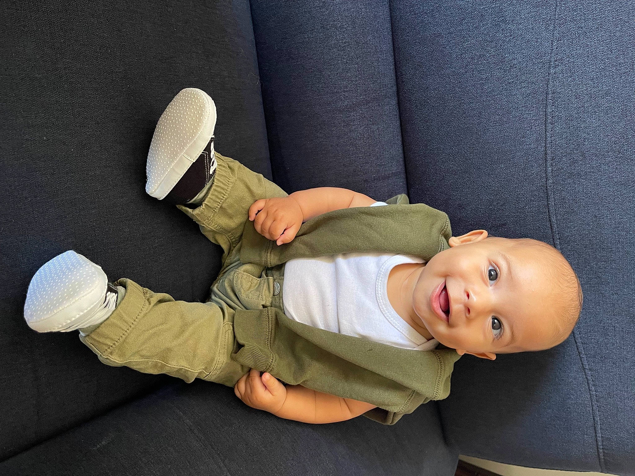 Aydan joined the competition — help win amazing prizes! baby, baby_sleeping, baby_toddler_clothing, child, comfort, elbow, finger, fun, gesture, hat, headgear, human_body, human_leg, knee, person, room, sitting, sleeve, smile, toddler