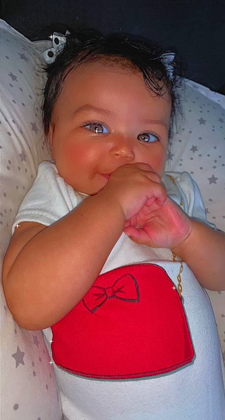 Khalani is registered to the contest to win money with this photo: arm, baby_toddler_clothing, cheek, chin, eyelash, face, forehead, hairstyle, hand, happy, iris, lip, mouth, neck, nose, organ, person, product, skin, smile