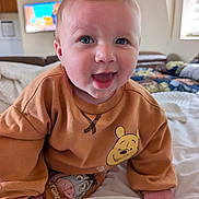 Kellen joined the competition — help win amazing prizes! baby, child, smiling, blue_eyes, sweatshirt, winnie_the_pooh, eeyore, bed, blanket, indoor, crawling, cute, happy, person, face, infant, clothing, room, furniture, portrait