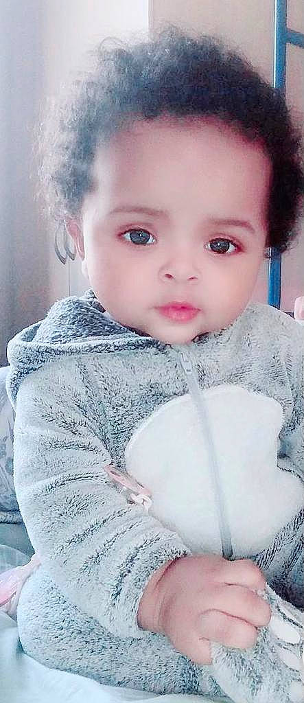 Amina participe au concours pour gagner de l'argent avec cette photo : baby_toddler_clothing, cheek, chin, eyebrow, eyelash, flash_photography, gesture, happy, iris, joint, lip, neck, nose, organ, outerwear, person, pink, shoulder, skin, sleeve