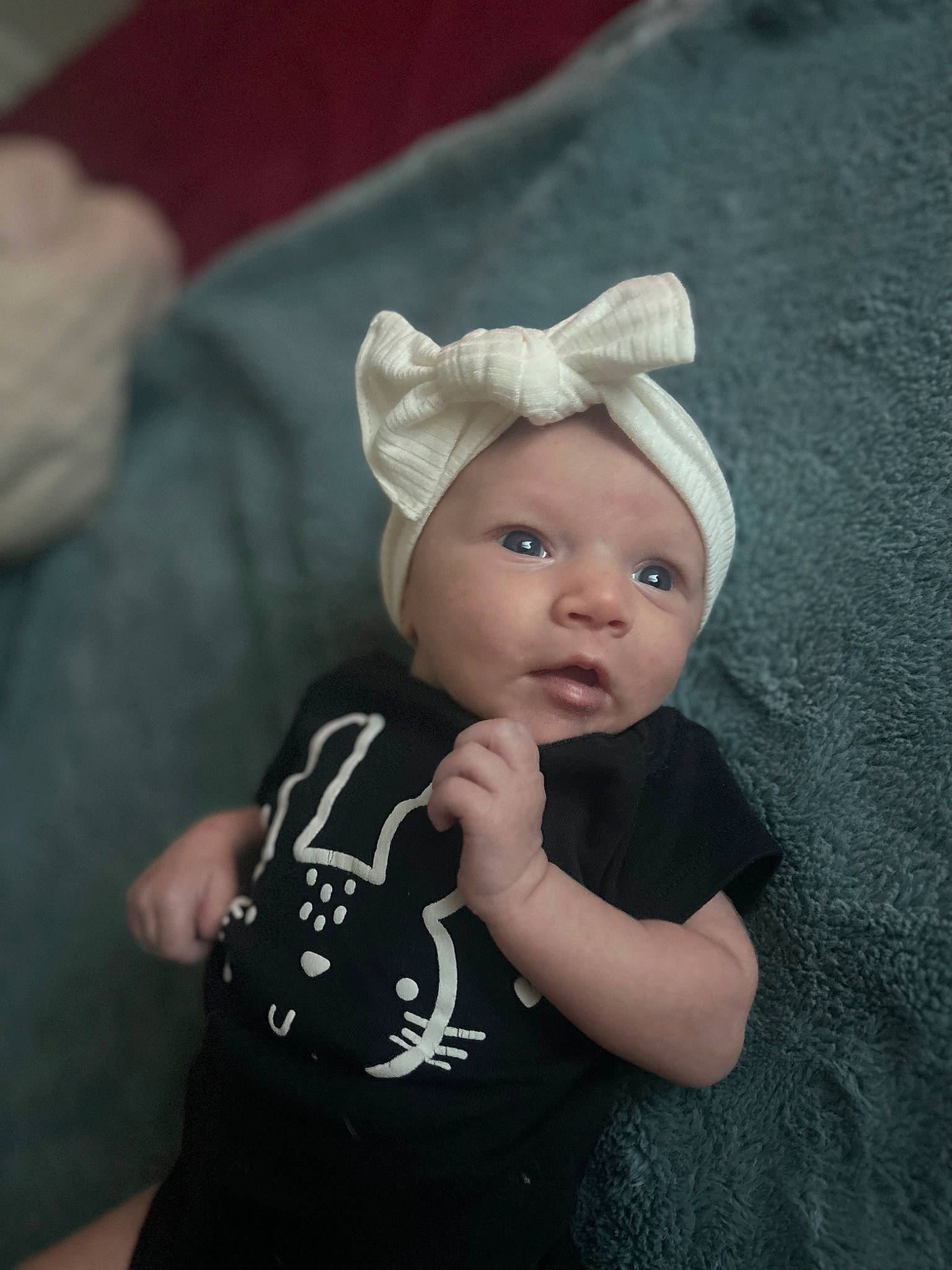 Winter is registered to the contest to win money with this photo: baby, baby_toddler_clothing, beanie, cap, child, costume_accessory, costume_hat, eye, fashion_accessory, flash_photography, fur, grass, grey, hat, monochrome_photography, pattern, person, portrait_photography, sleeve, t_shirt