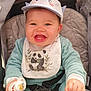 baby, bib, blue_clothing, child, clothing, cute, face, hand, happy, hat, indoor, infant, pacifier, panda, person, portrait, seatbelt, smile, stroller, young_child