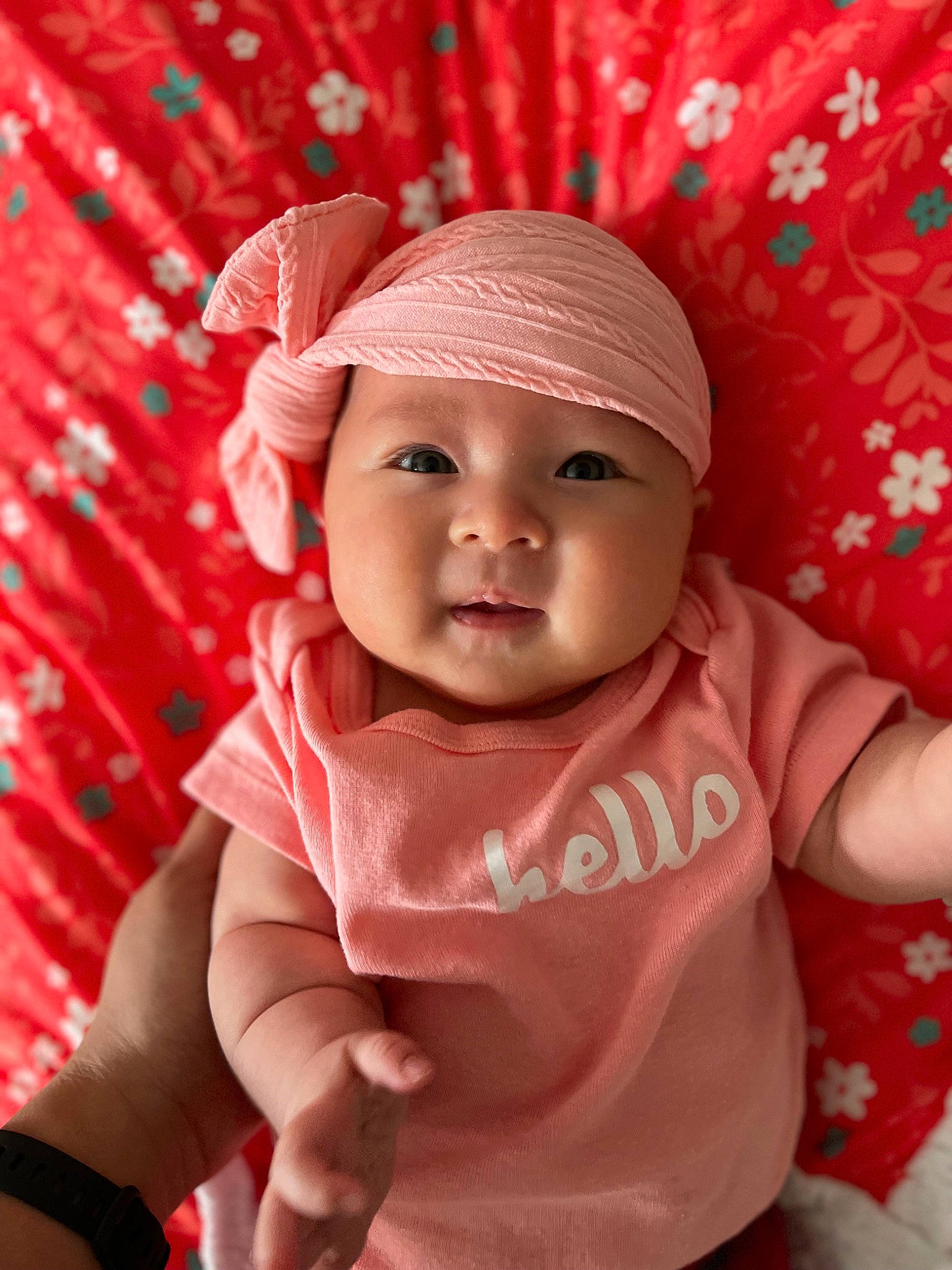 Jade is registered to the contest to win money with this photo: baby, baby_toddler_clothing, cap, cheek, child, fashion_accessory, fun, happy, headgear, headwear, linens, lip, magenta, pattern, person, pink, product, skin, sleeve, smile