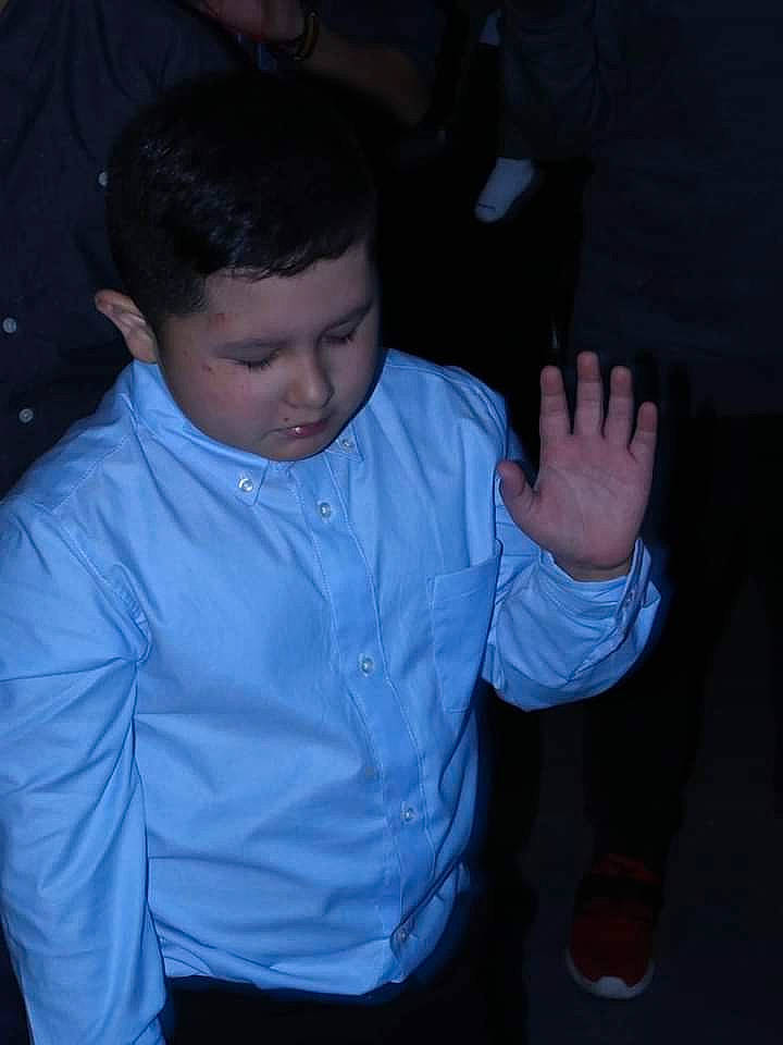 Carlos is registered to the contest to win money with this photo: baby_toddler_clothing, cheek, child, darkness, dress_shirt, ear, elbow, electric_blue, finger, formal_wear, fun, gesture, happy, iris, person, sitting, sleeve, thumb, toddler