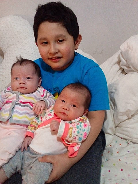 Carlos is registered to the contest to win money with this photo: baby, baby_toddler_clothing, cheek, child, comfort, couch, event, eye, face, fun, hair, happy, head, iris, joy, nose, person, skin, sleeve, smile