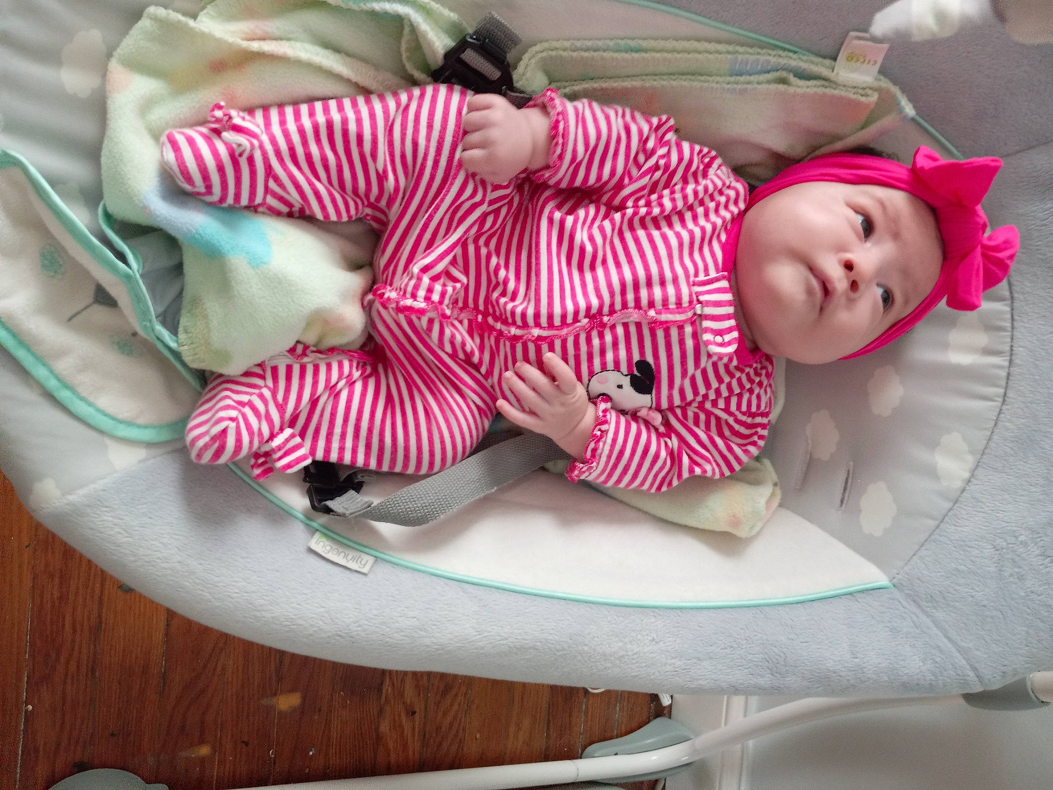 Arianna is registered to the contest to win money with this photo: baby, baby_carriage, baby_products, baby_toddler_clothing, carmine, child, comfort, hardwood, headwear, lap, linens, magenta, pattern, person, pink, room, sitting, sleeve, sock, thigh