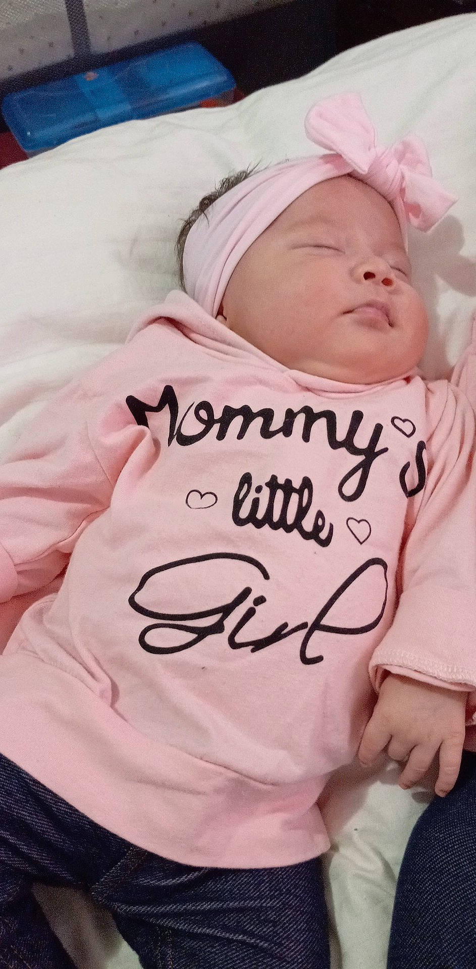 Arianna is registered to the contest to win money with this photo: baby, baby_products, baby_sleeping, baby_toddler_clothing, bedtime, cheek, child, comfort, event, face, font, happy, hat, linens, person, pink, room, skin, sleeve, t_shirt