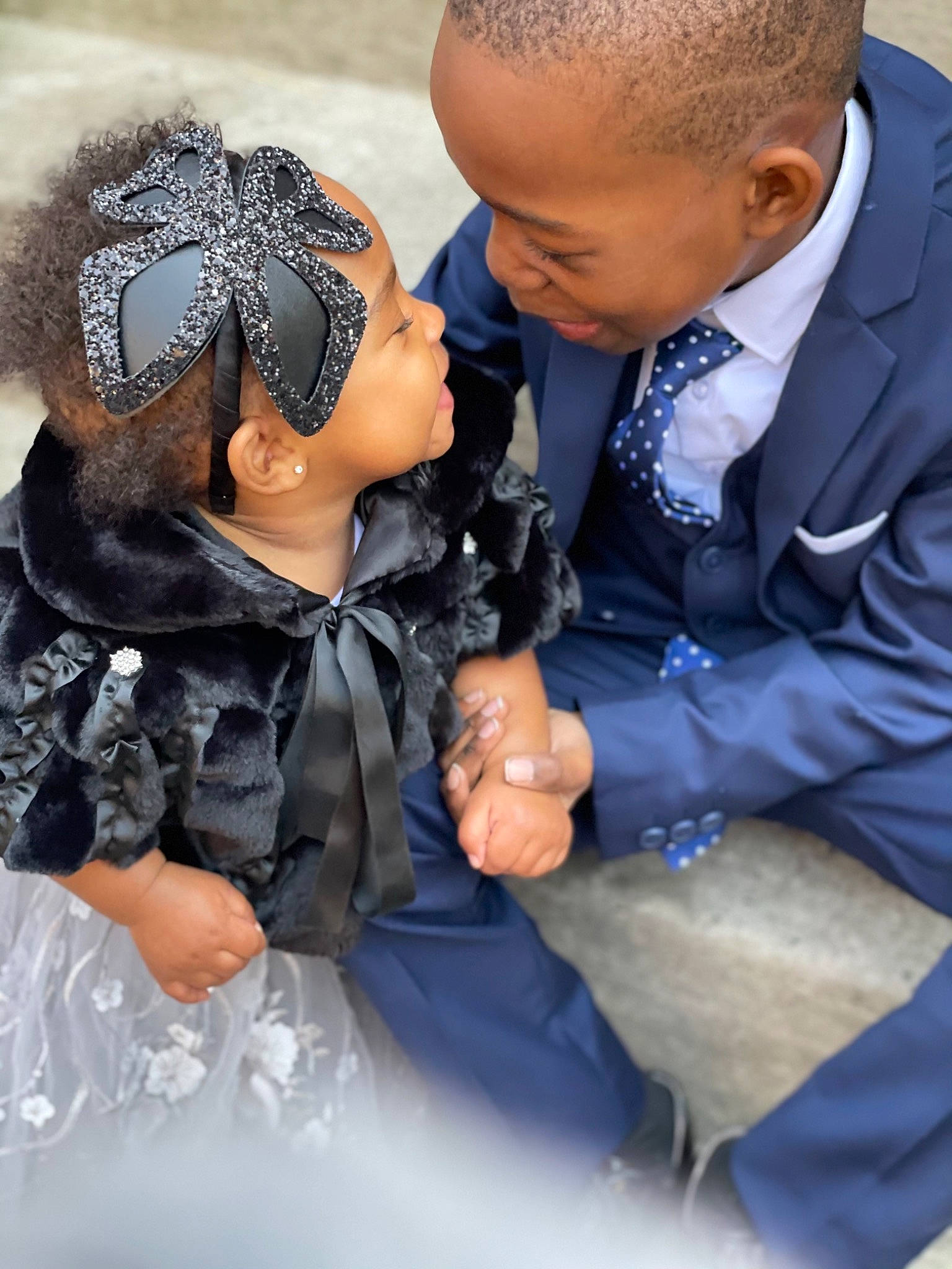 Kasey joined the competition — help win amazing prizes! black_hair, bridal_accessory, child, clothing, dress, event, fashion_accessory, fashion_design, flash_photography, formal_wear, fun, gesture, glove, hairstyle, happy, headpiece, jewellery, person, skin, toddler