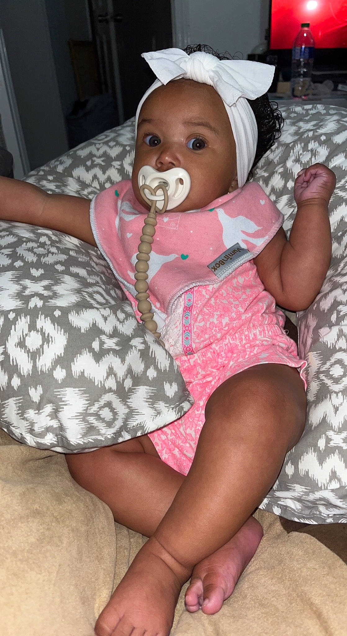 Elayna joined the competition — help win amazing prizes! baby, baby_toddler_clothing, cheek, comfort, dress, eye, face, finger, head, human_body, iris, knee, lap, leg, mouth, organ, person, pink, skin, textile