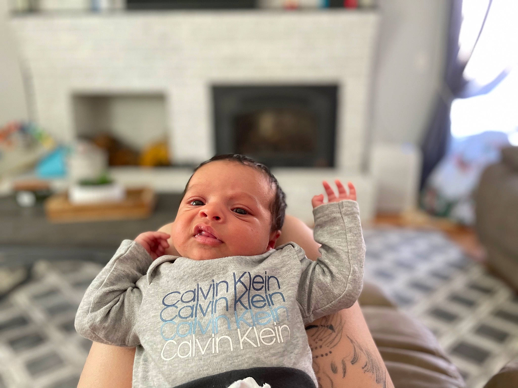 Liam joined the competition — help win amazing prizes! baby, baby_products, baby_toddler_clothing, child, comfort, fun, happy, leisure, person, picture_frame, portrait_photography, room, sitting, smile, t_shirt, television, toddler, vacation