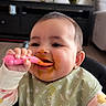 Bellamy joined the competition — help win amazing prizes! baby, child, high_chair, feeding, spoon, bib, messy_face, happy, indoor, living_room, plant, furniture, smile, portrait, person, clothing, food, cute, infant, home