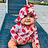 Bellamy is registered to the contest to win money with this photo: baby, child, infant, smiling, strawberry, hat, outdoor, chair, blue, clothing, cute, happy, sitting, person, face, skin, foot, hand, headwear, playful