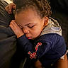 Willie is registered to the contest to win money with this photo: child, toddler, sleeping, nap, curly_hair, hoodie, jacket, indoor, closeup, face, peaceful, resting, cozy, young_child, portrait, cute, relaxed, person, skin, hand