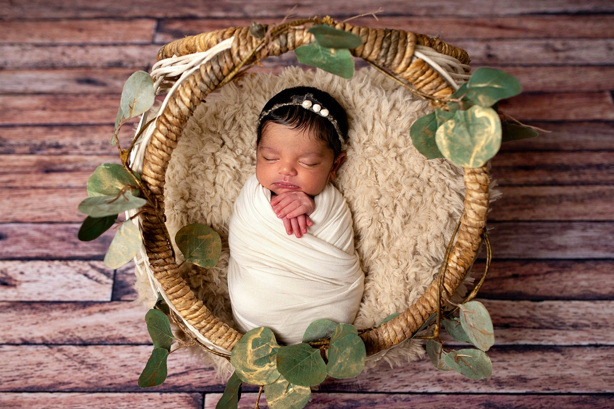 Shanti joined the competition — help win amazing prizes! baby_products, basket, child, comfort, costume_hat, eye, fashion_accessory, fawn, grass, hat, head, headpiece, leaf, people_in_nature, person, plant, sitting, sun_hat, twig, wicker