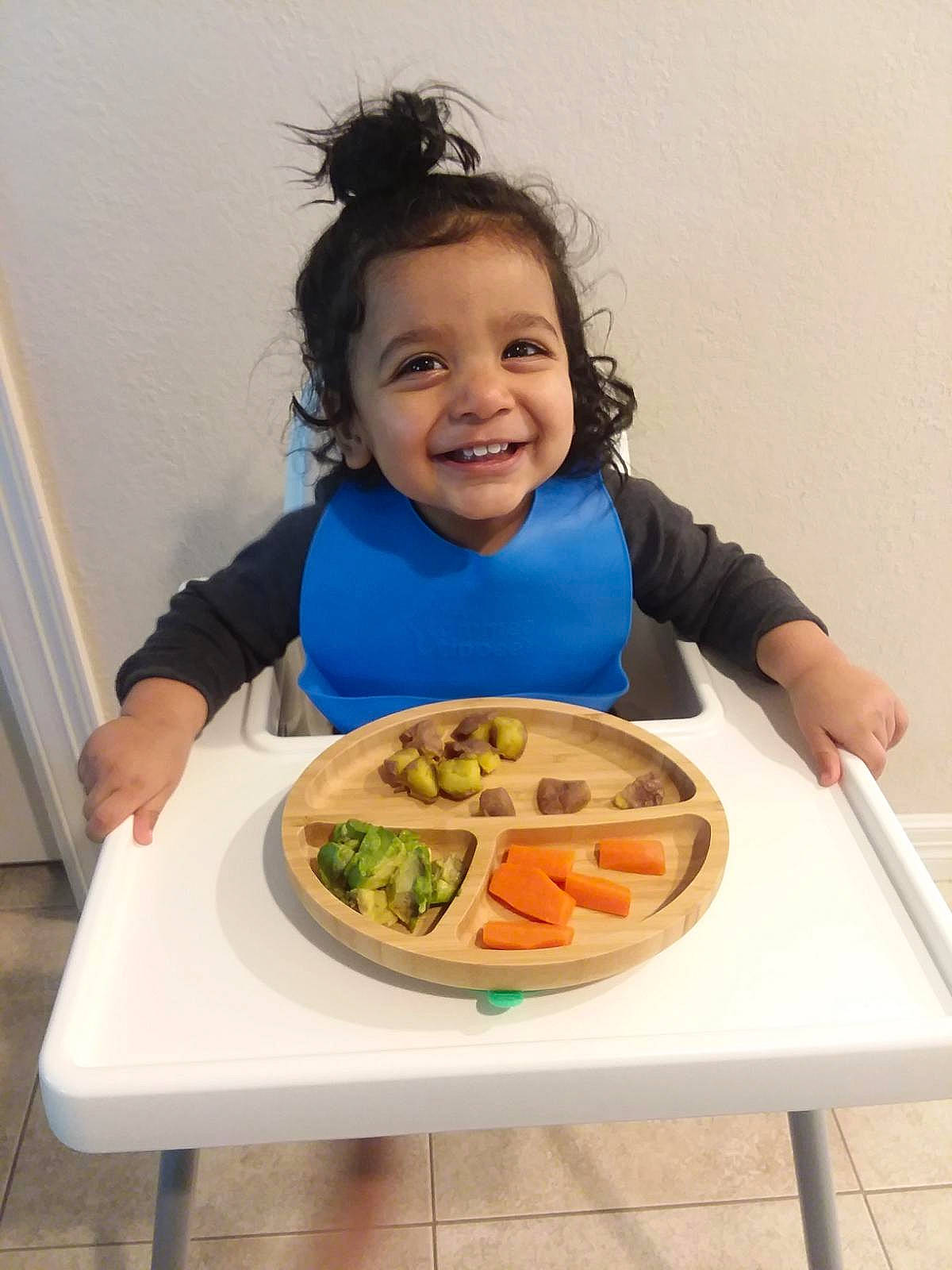 Keshav is registered to the contest to win money with this photo: arm, chair, cuisine, dish, dishware, dress, food, food_craving, fruit, happy, ingredient, joy, person, plate, recipe, sharing, sleeve, smile, t_shirt, table