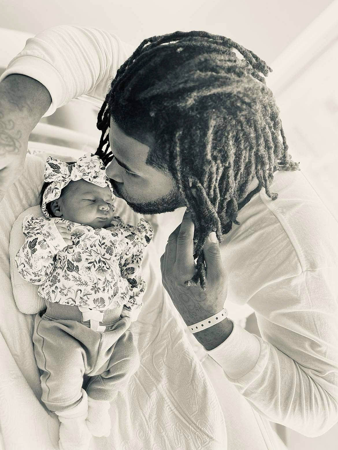 Melia is registered to the contest to win money with this photo: baby, black_and_white, child, comfort, elbow, eye, gesture, hair, hand, happy, head, human_body, interaction, iris, monochrome_photography, mouth, person, skin, style, toddler