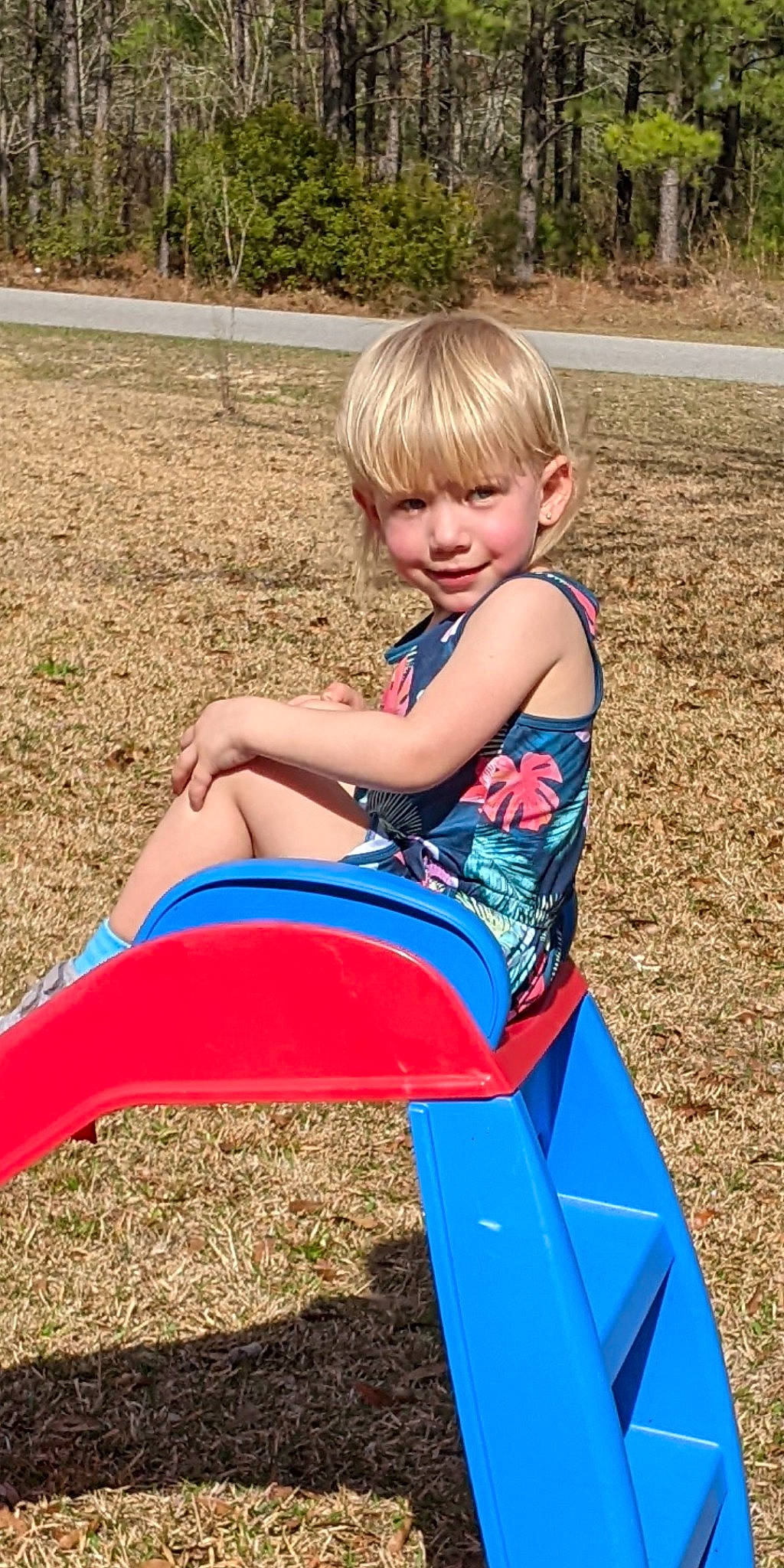 Scarlet joined the competition — help win amazing prizes! baby_toddler_clothing, blond, child, chute, city, electric_blue, fun, grass, human_settlement, joy, leisure, nature, people_in_nature, person, plant, playground, public_space, recreation, sitting, smile