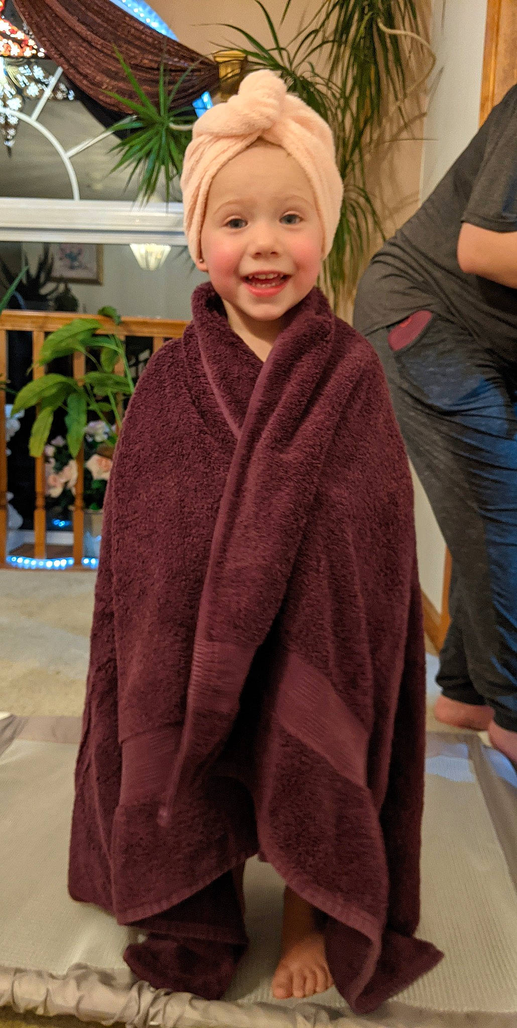 Scarlet is registered to the contest to win money with this photo: blond, cap, child, clothing, event, facial_expression, fashion_accessory, flooring, formal_wear, fun, hairstyle, happy, headwear, joy, leisure, person, plant, skin, sleeve, smile