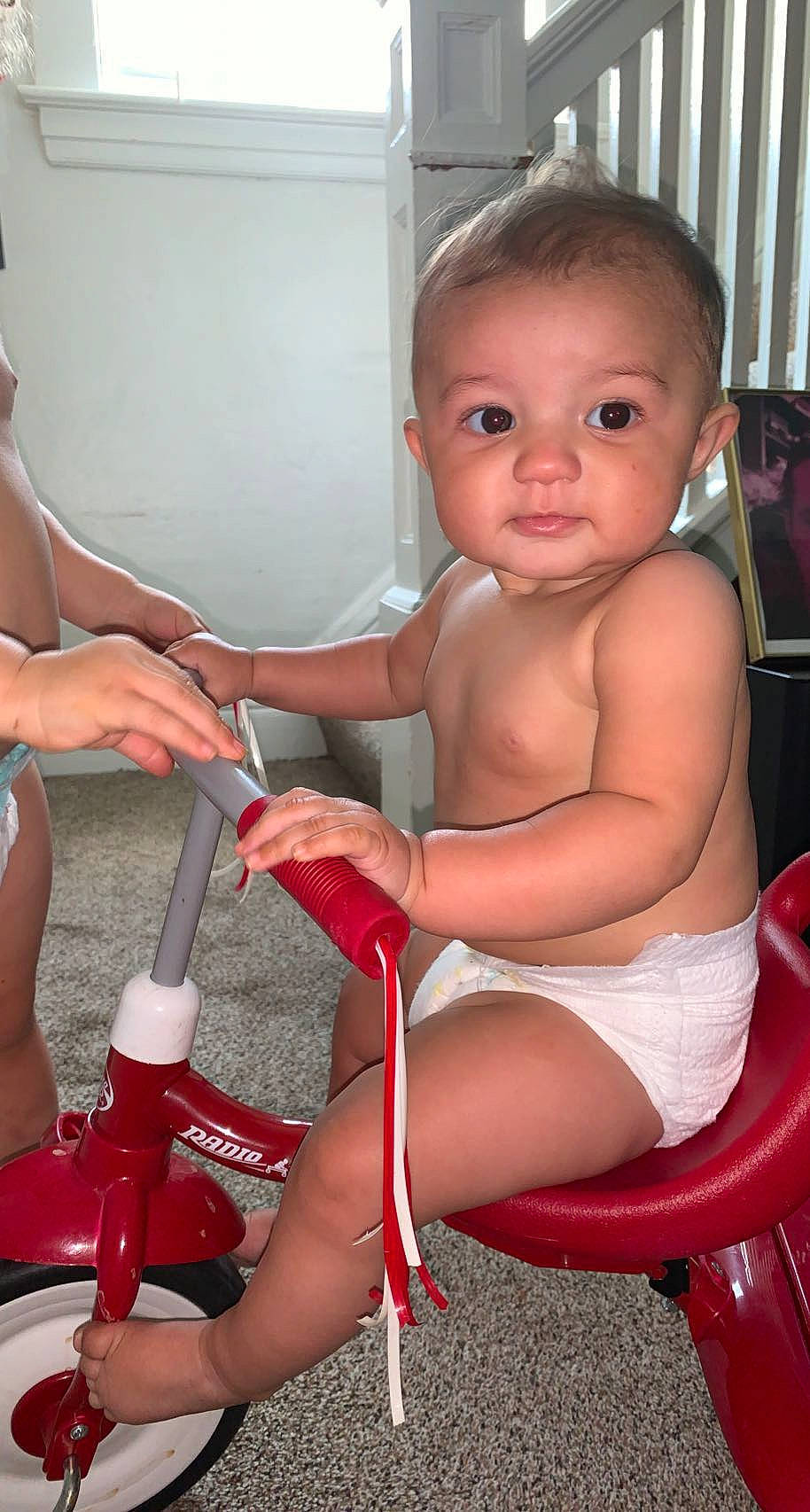 Janiyle is registered to the contest to win money with this photo: arm, cheek, chest, chin, finger, hand, joint, knee, leg, lip, mouth, muscle, nail, neck, person, shoulder, skin, thigh, thumb, toddler