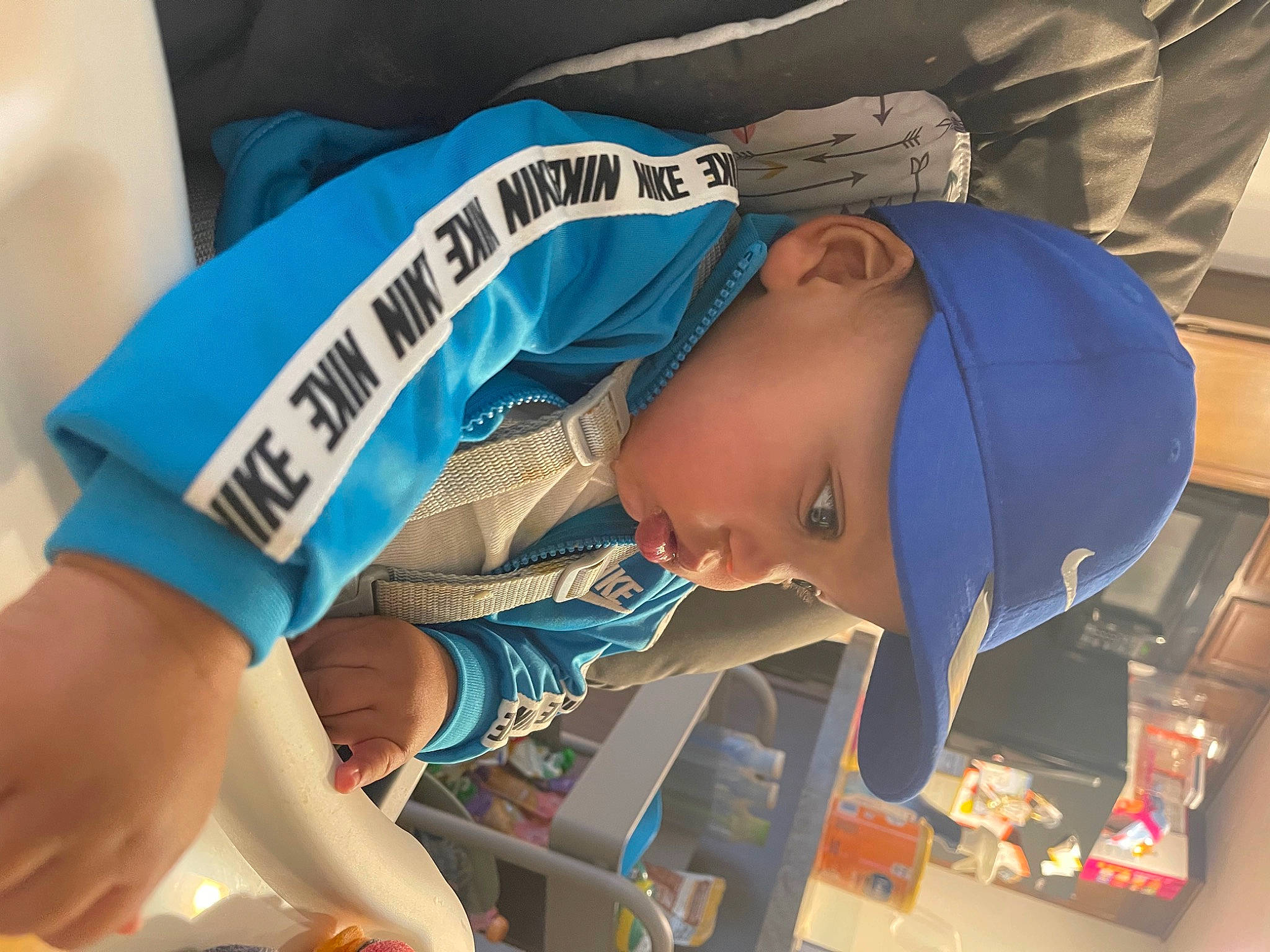 Damian is registered to the contest to win money with this photo: baseball_cap, cap, child, competition_event, elbow, electric_blue, fun, hat, headwear, human_leg, knee, person, personal_protective_equipment, recreation, sleeve, t_shirt, thigh, toddler