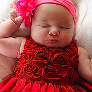 Maylina joined the competition — help win amazing prizes! baby, sleeping, red_dress, headband, flower, infant, peaceful, cute, soft_blanket, closeup, portrait, child, adorable, resting, pink, skin, hand, face, newborn, cozy