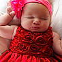 baby, sleeping, red_dress, headband, flower, infant, peaceful, cute, soft_blanket, closeup, portrait, child, adorable, resting, pink, skin, hand, face, newborn, cozy