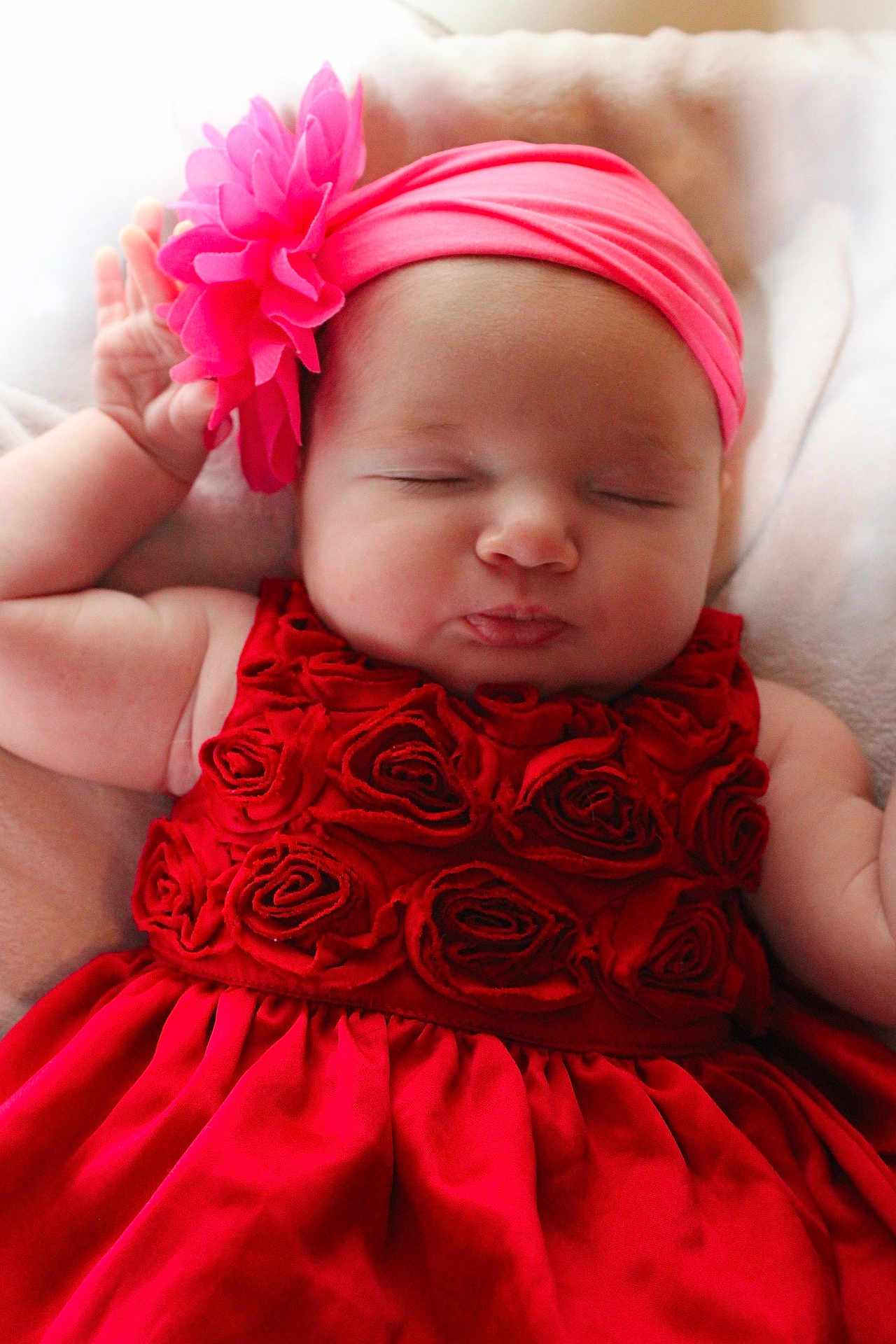 Maylina joined the competition — help win amazing prizes! baby, sleeping, red_dress, headband, flower, infant, peaceful, cute, soft_blanket, closeup, portrait, child, adorable, resting, pink, skin, hand, face, newborn, cozy