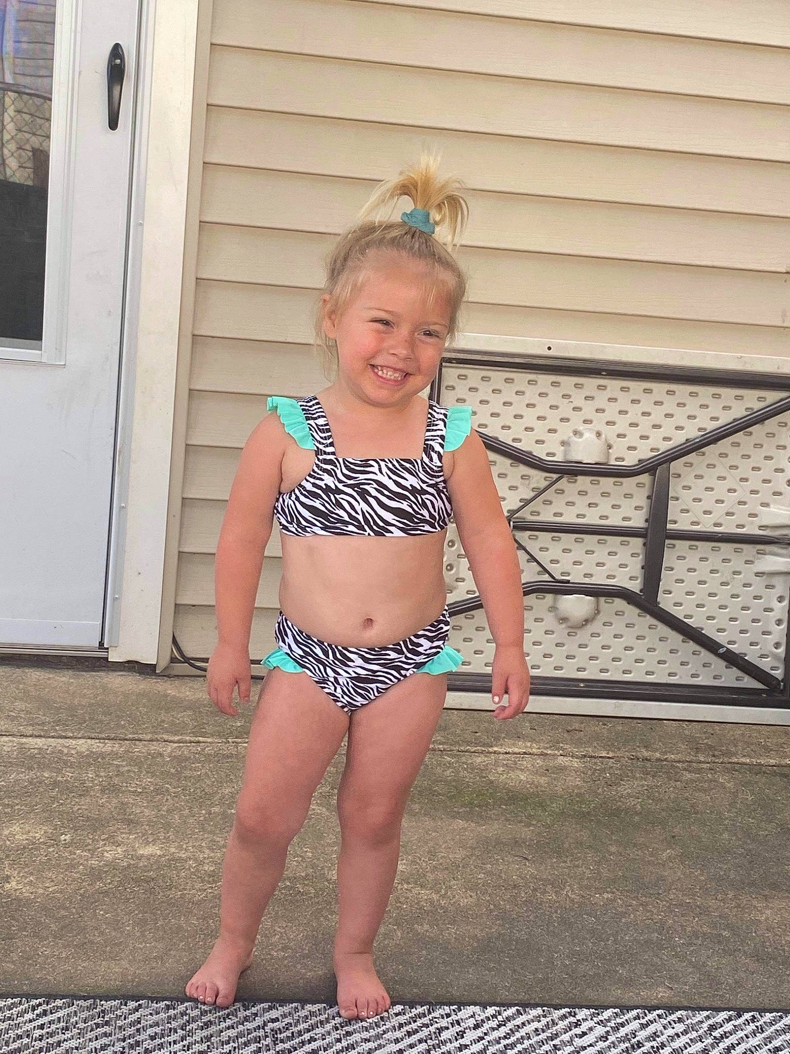 Charlee is registered to the contest to win money with this photo: abdomen, barefoot, brassiere, chest, door, electric_blue, fun, human_leg, joy, leisure, lingerie_top, navel, person, smile, swimwear, thigh, toddler, trunk, undergarment, underpants