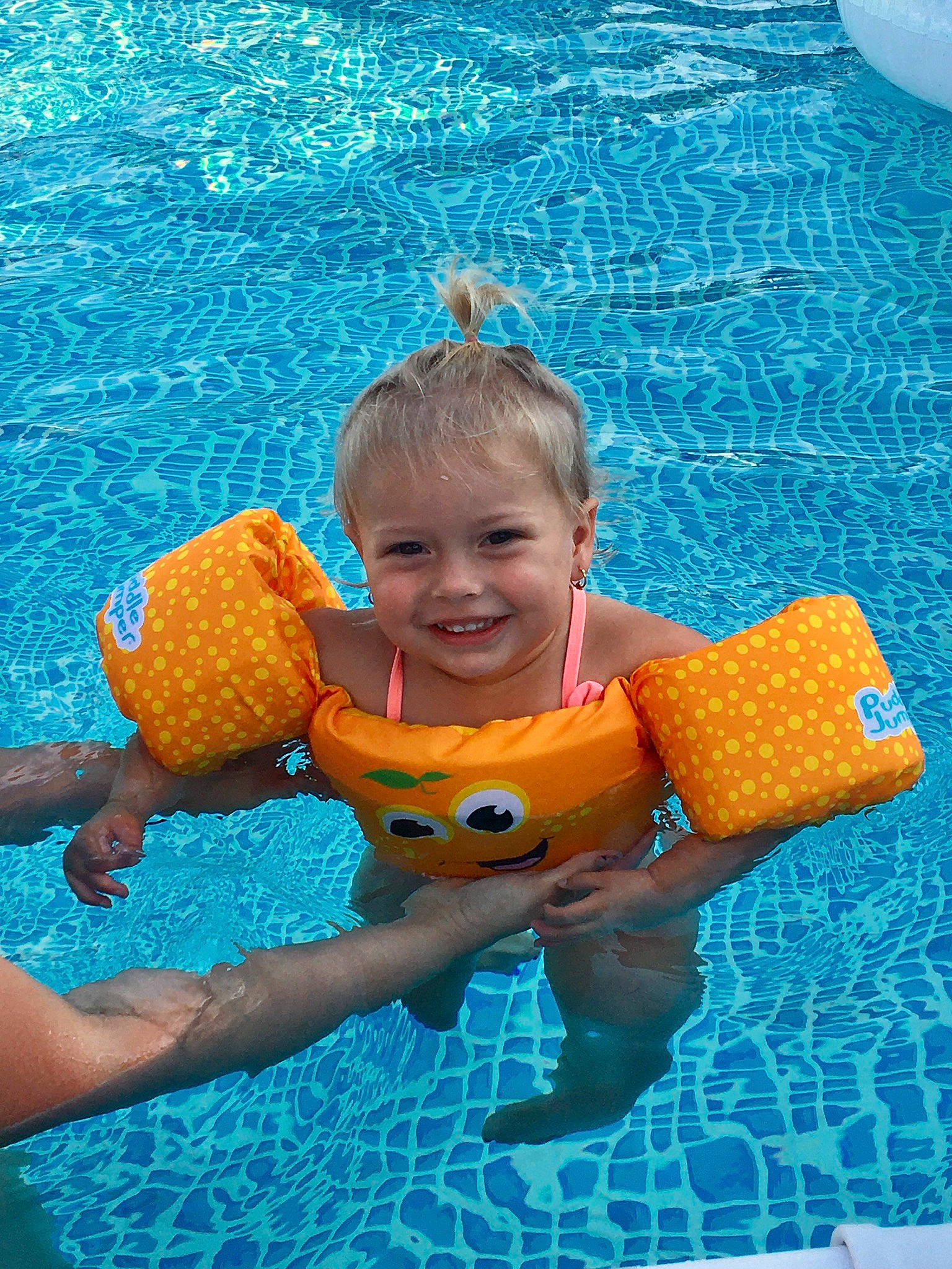Charlee joined the competition — help win amazing prizes! aqua, azure, baby_toddler_clothing, blue, child, electric_blue, facial_expression, fun, happy, joy, leisure, orange, people_in_nature, person, personal_protective_equipment, recreation, smile, summer, swimming_pool, toddler