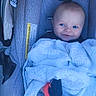 baby, baby_gear, blanket, blue_eyes, car_seat, child, clothing, cozy, cute, fabric, face, head, indoors, infant, portrait, seated, smile, soft, wrapped, young