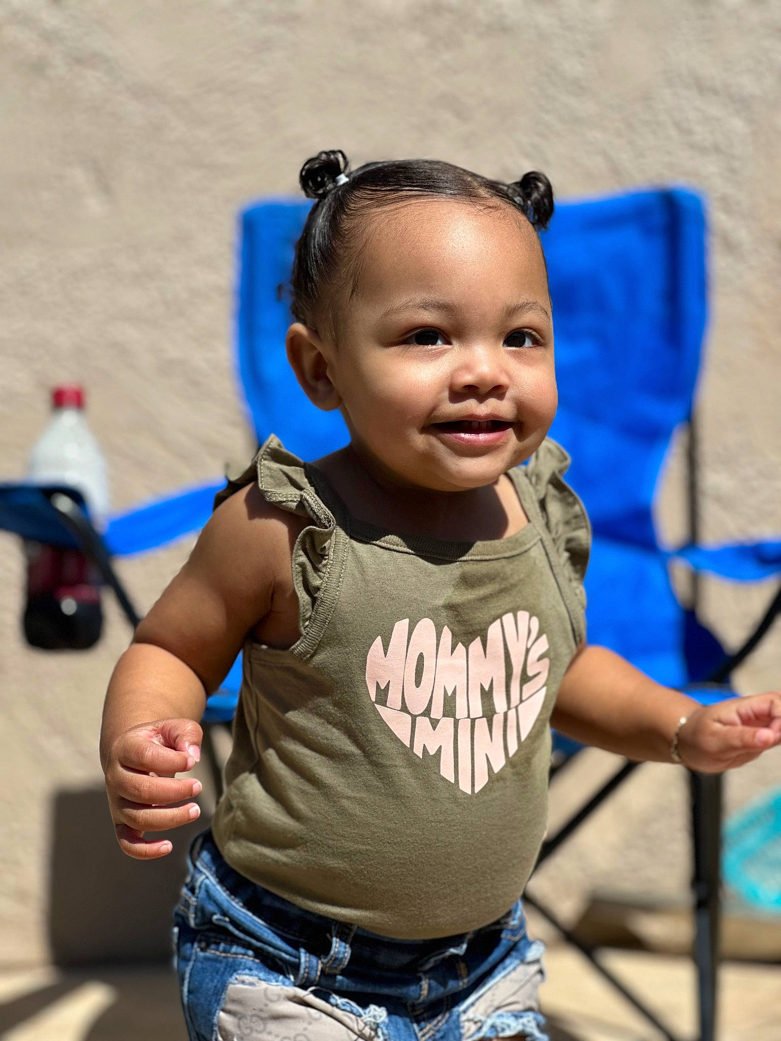 Zuri is registered to the contest to win money with this photo: child, chin, cool, electric_blue, event, eyewear, fun, gesture, hairstyle, happy, leisure, person, recreation, shoulder, skin, sleeve, smile, snapshot, standing, t_shirt