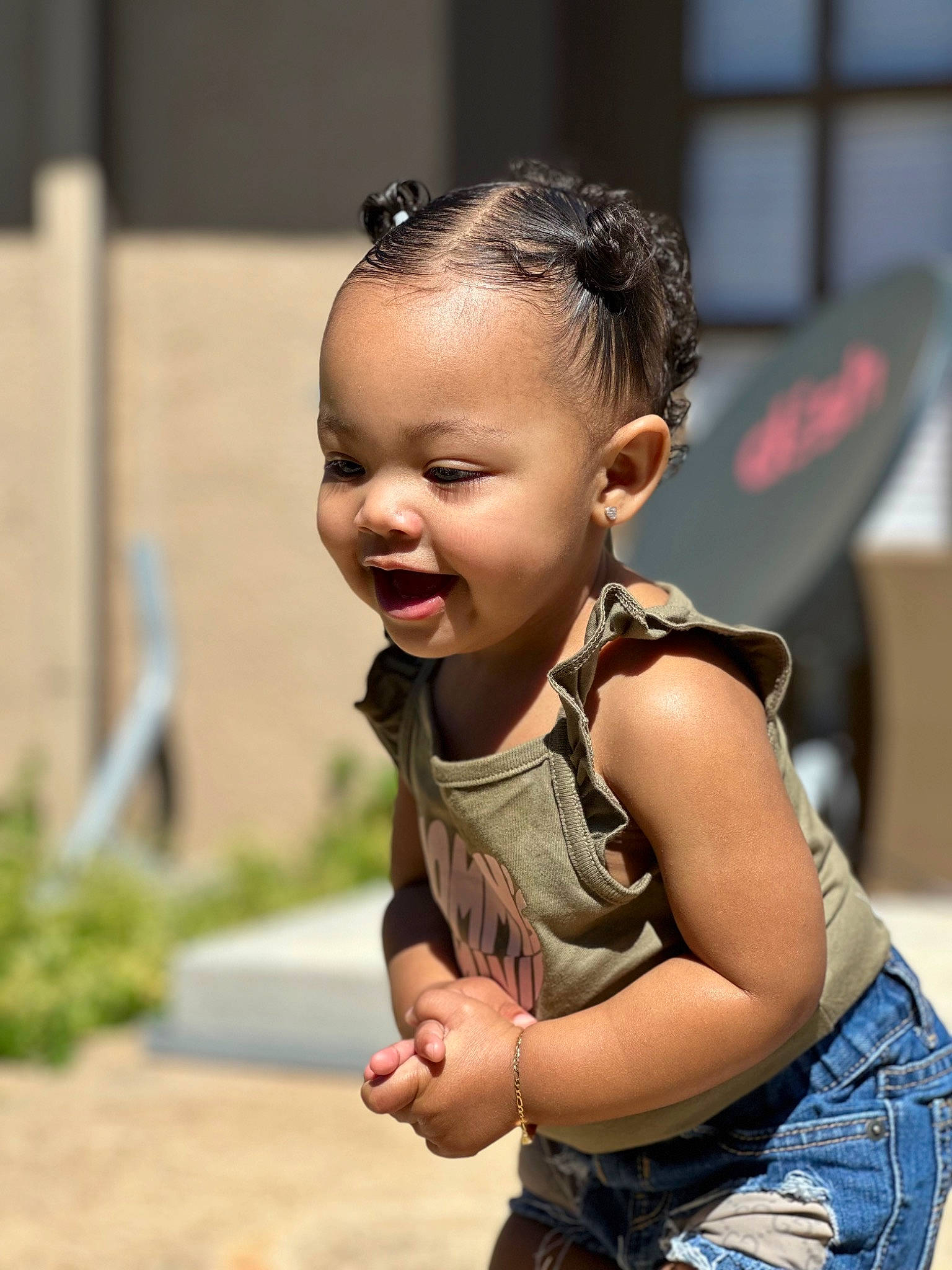 Zuri joined the competition — help win amazing prizes! arm, belt, child, event, fun, grass, hand, happy, jewellery, leisure, necklace, person, plant, recreation, shoulder, sitting, street, t_shirt, toddler, tradition