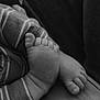 Emmett joined the competition — help win amazing prizes! baby, black_and_white, child, close_up, comfort, cuddly, cute, detail, feet, infant, monochrome, peaceful, resting, skin, small, soft_texture, striped_clothing, toes, warmth, young