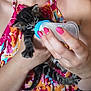 affection, animal_care, baby_animal, bottle, cat, closeup, colorful_clothing, comfort, cute, domestic_animal, feeding, floral_pattern, hand, indoor, kitten, nails, person, pet, pink_nail_polish, small_animal