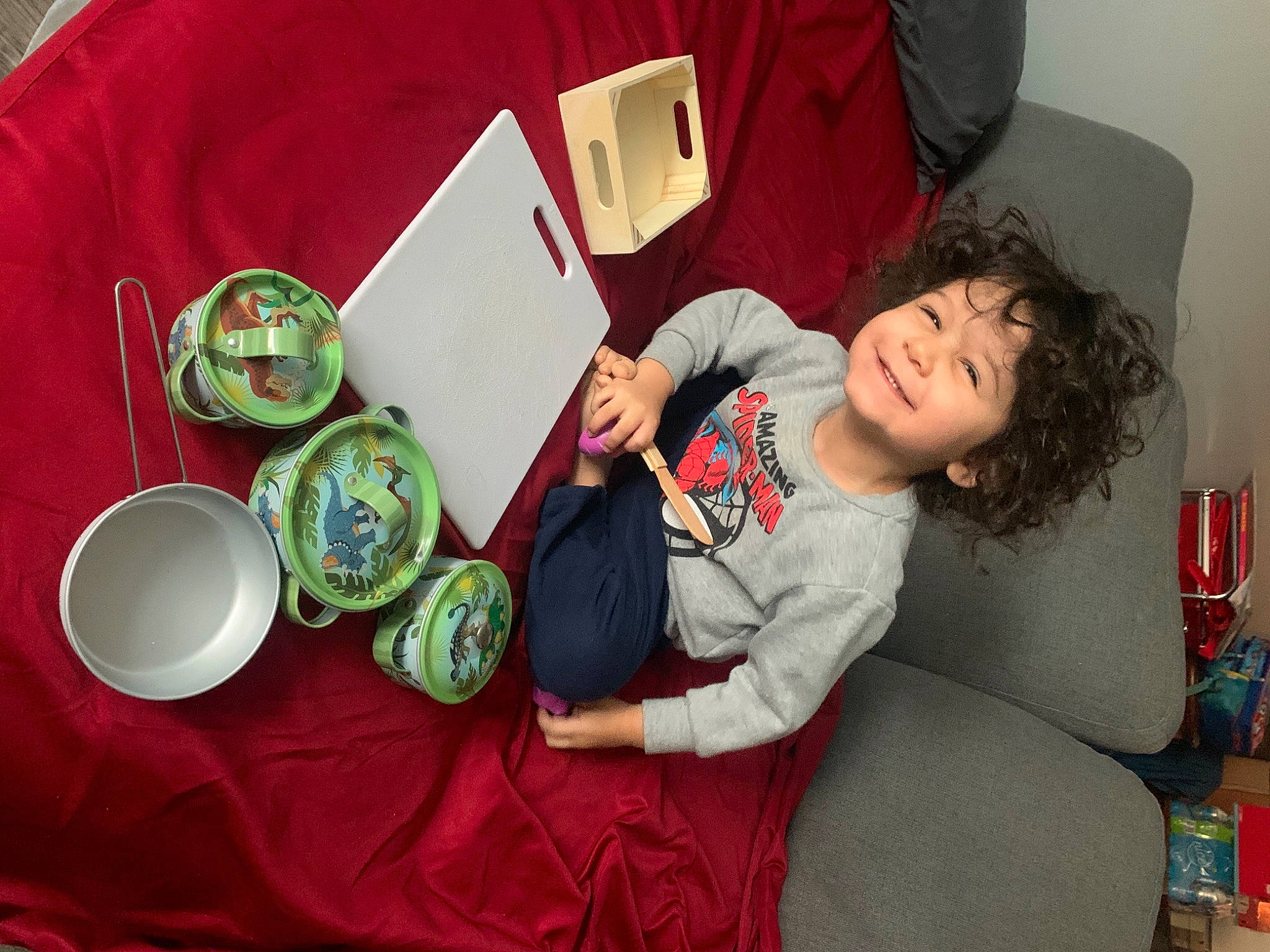 Sebastian joined the competition — help win amazing prizes! child, christmas_eve, comfort, couch, dishware, event, holiday, joy, lap, linens, person, plate, platter, room, serveware, sitting, sleeve, smile, t_shirt, tableware