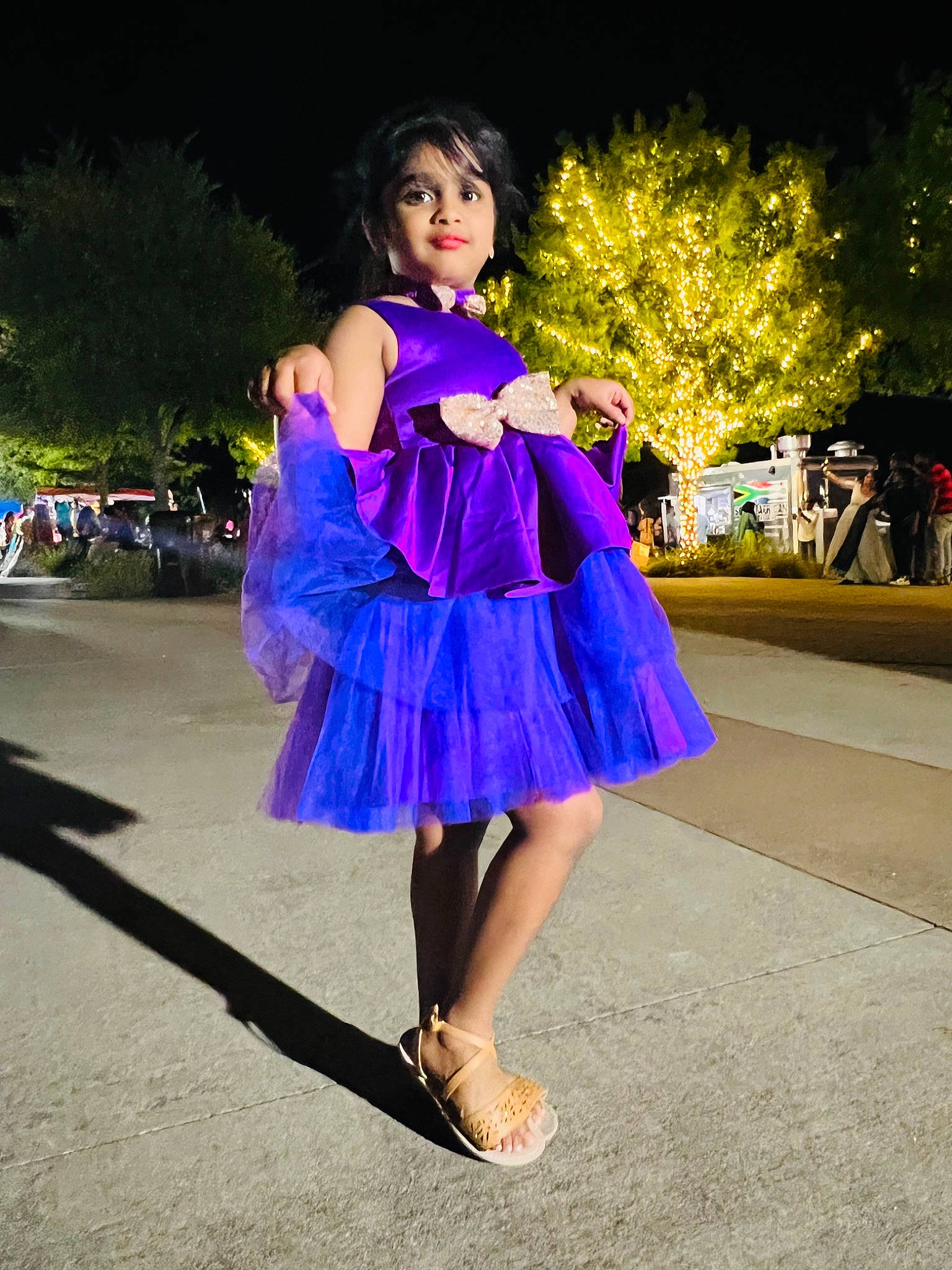 Akshaya is registered to the contest to win money with this photo: cocktail_dress, day_dress, dress, electric_blue, event, fashion_accessory, fashion_design, fashion_model, formal_wear, happy, human_leg, knee, long_hair, magenta, person, recreation, sandal, smile, thigh, tree
