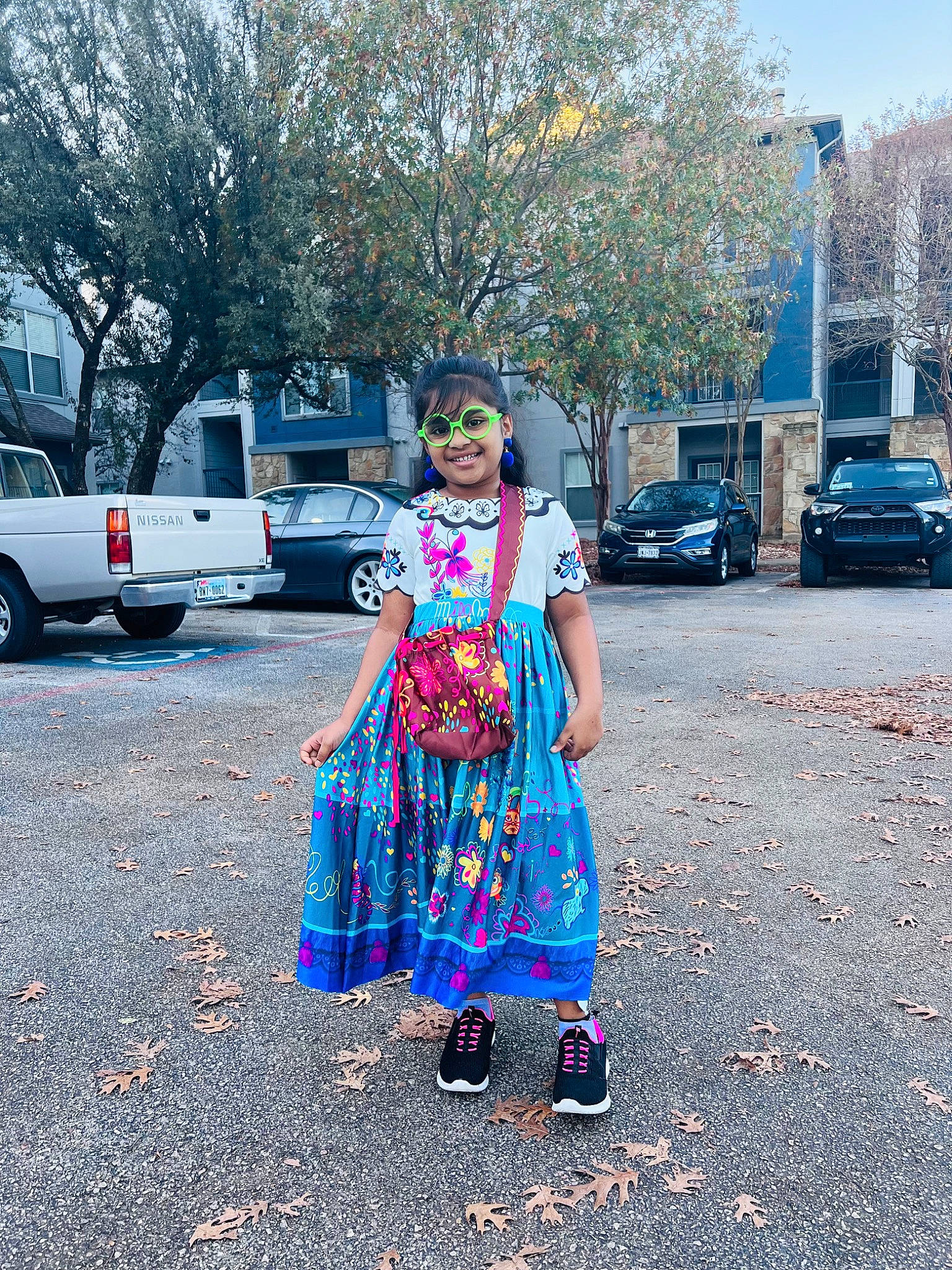 Akshaya is registered to the contest to win money with this photo: asphalt, car, dress, electric_blue, event, fun, joy, land_vehicle, leisure, magenta, person, road, road_surface, sidewalk, sky, street, summer, tire, travel, tree