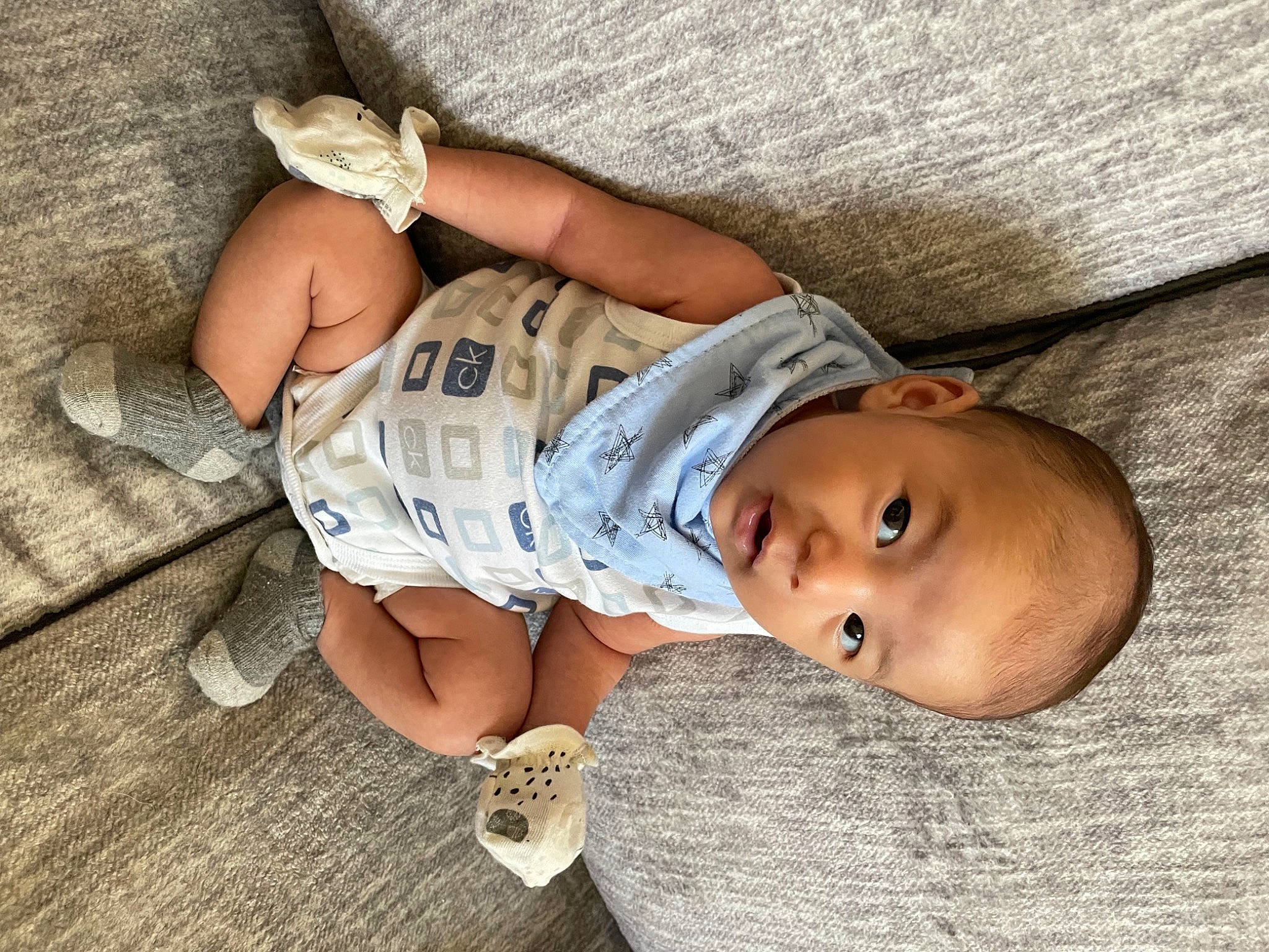 Ezio joined the competition — help win amazing prizes! arm, baby, baby_toddler_clothing, comfort, eye, foot, glasses, grass, hand, hat, headgear, human_body, human_leg, leg, person, sitting, skin, thigh, toddler, tree