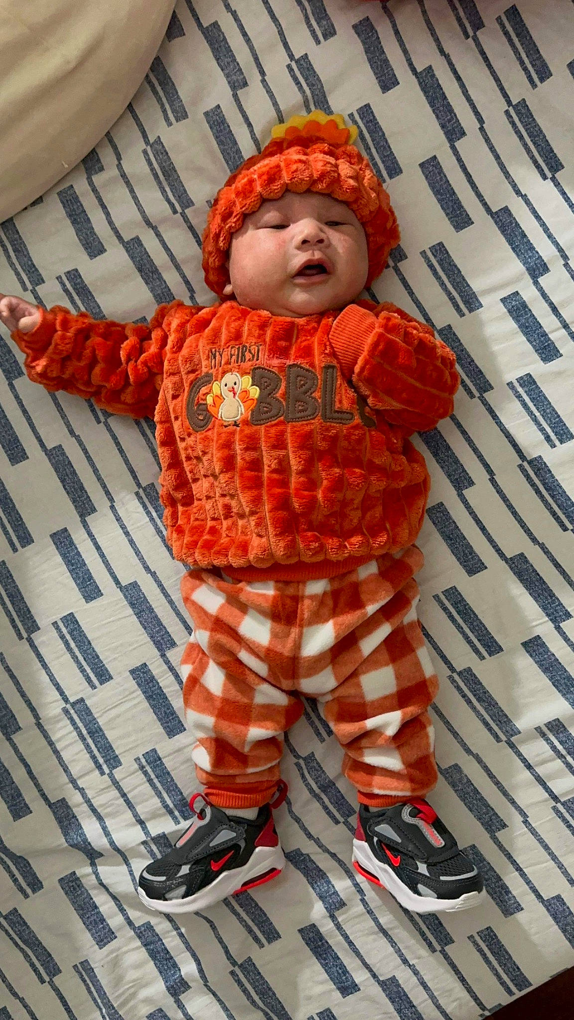 Jason joined the competition — help win amazing prizes! baby, baby_toddler_clothing, beanie, carmine, child, cool, costume, face, flooring, fun, headwear, orange, overall, pattern, peach, person, personal_protective_equipment, plaid, sandal, sleeve