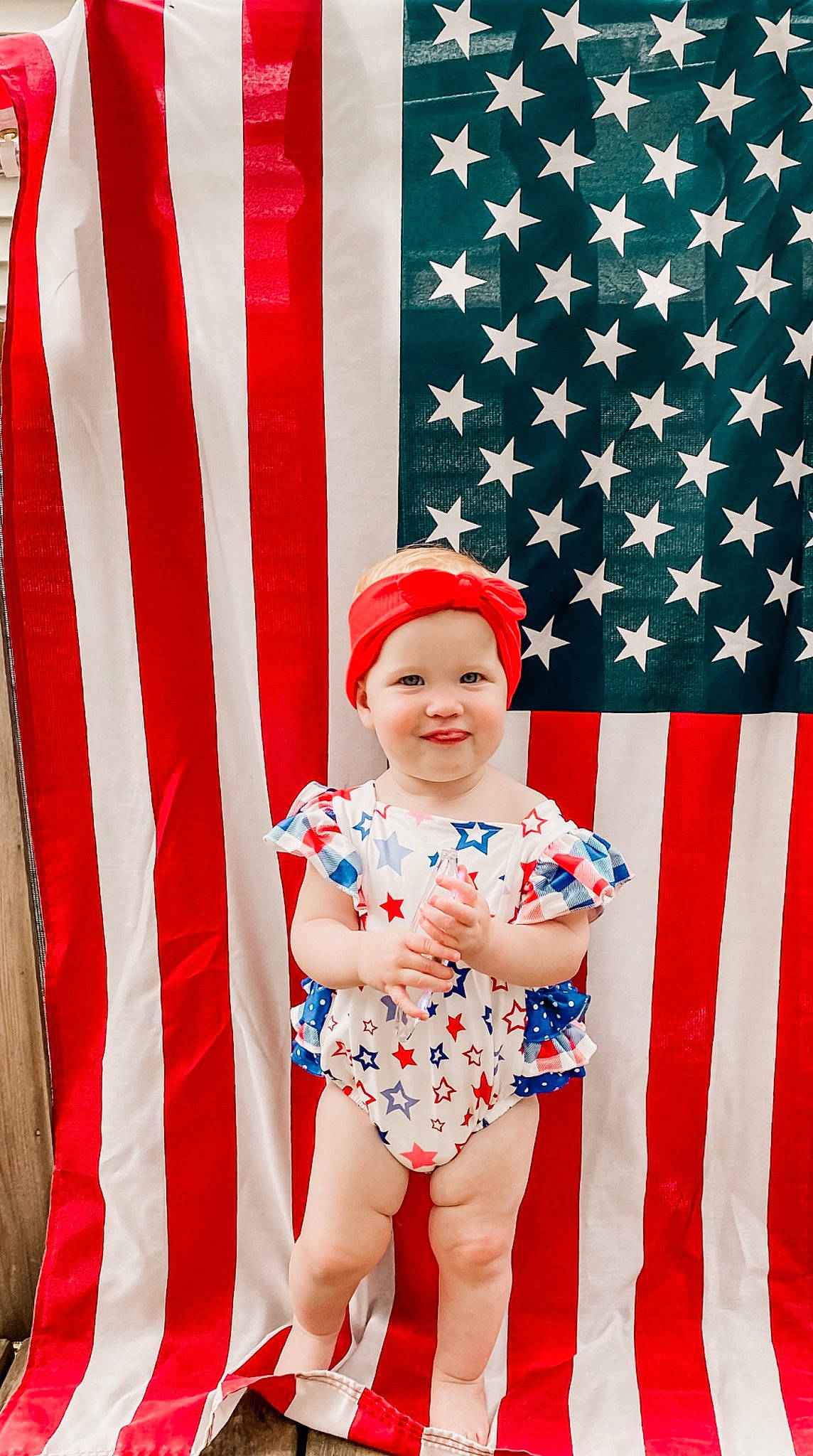 Irene is registered to the contest to win money with this photo: baby, baby_toddler_clothing, cap, costume_hat, design, electric_blue, event, face, flag, flag_day_usa, flag_of_the_united_states, happy, hat, headwear, holiday, joy, pattern, person, red, sleeve