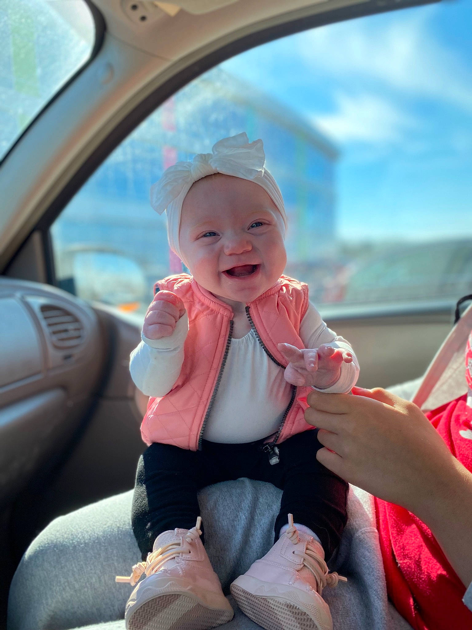 Madelynn is registered to the contest to win money with this photo: auto_part, automotive_design, automotive_exterior, car, car_seat, child, family_car, finger, happy, hat, headwear, motor_vehicle, person, pink, skin, sky, smile, steering_wheel, toddler, vehicle_door