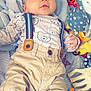 Kaylon a rejoint le concours — aidez-le/la à gagner de superbes lots ! baby, infant, child, face, clothing, suspenders, pants, toy, colorful, plush, blanket, striped, cute, cute_baby, lying_down, hand, looking_up, indoor, soft, playtime