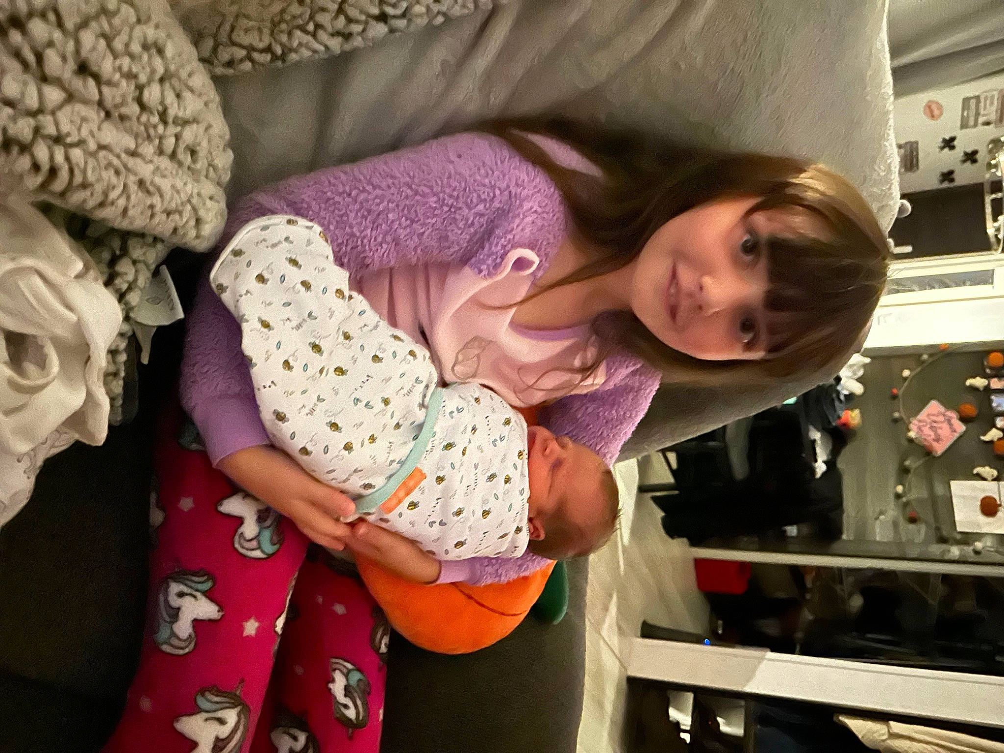 Reaghan joined the competition — help win amazing prizes! baby, baby_toddler_clothing, cheek, child, comfort, eye, fun, happy, human_body, joy, linens, magenta, pattern, person, purple, room, sleeve, smile, thread, thumb