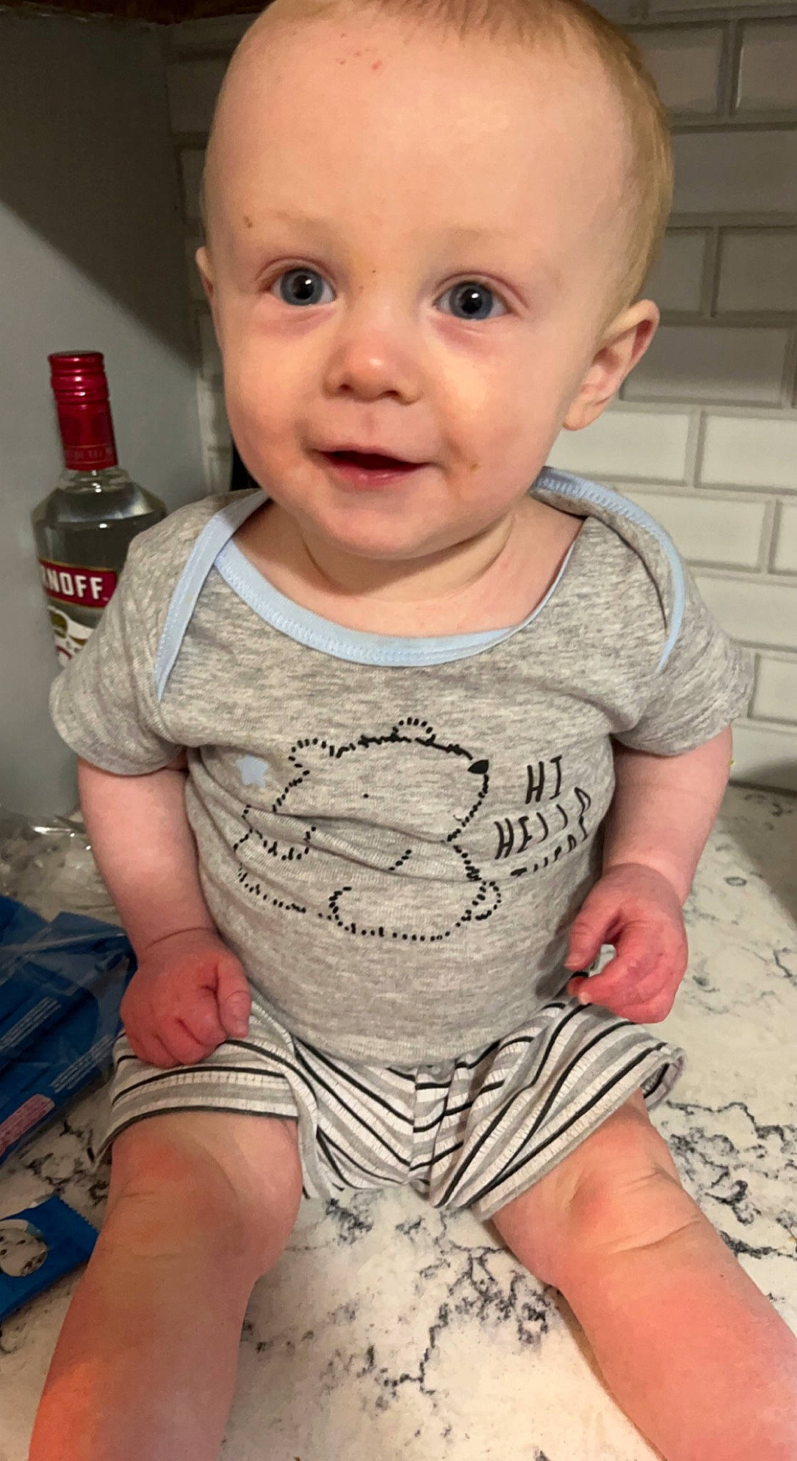 Chance is registered to the contest to win money with this photo: baby, baby_toddler_clothing, cheek, chin, eye, eyebrow, facial_expression, finger, human, iris, lip, mouth, neck, organ, person, skin, sleeve, smile, standing, toddler