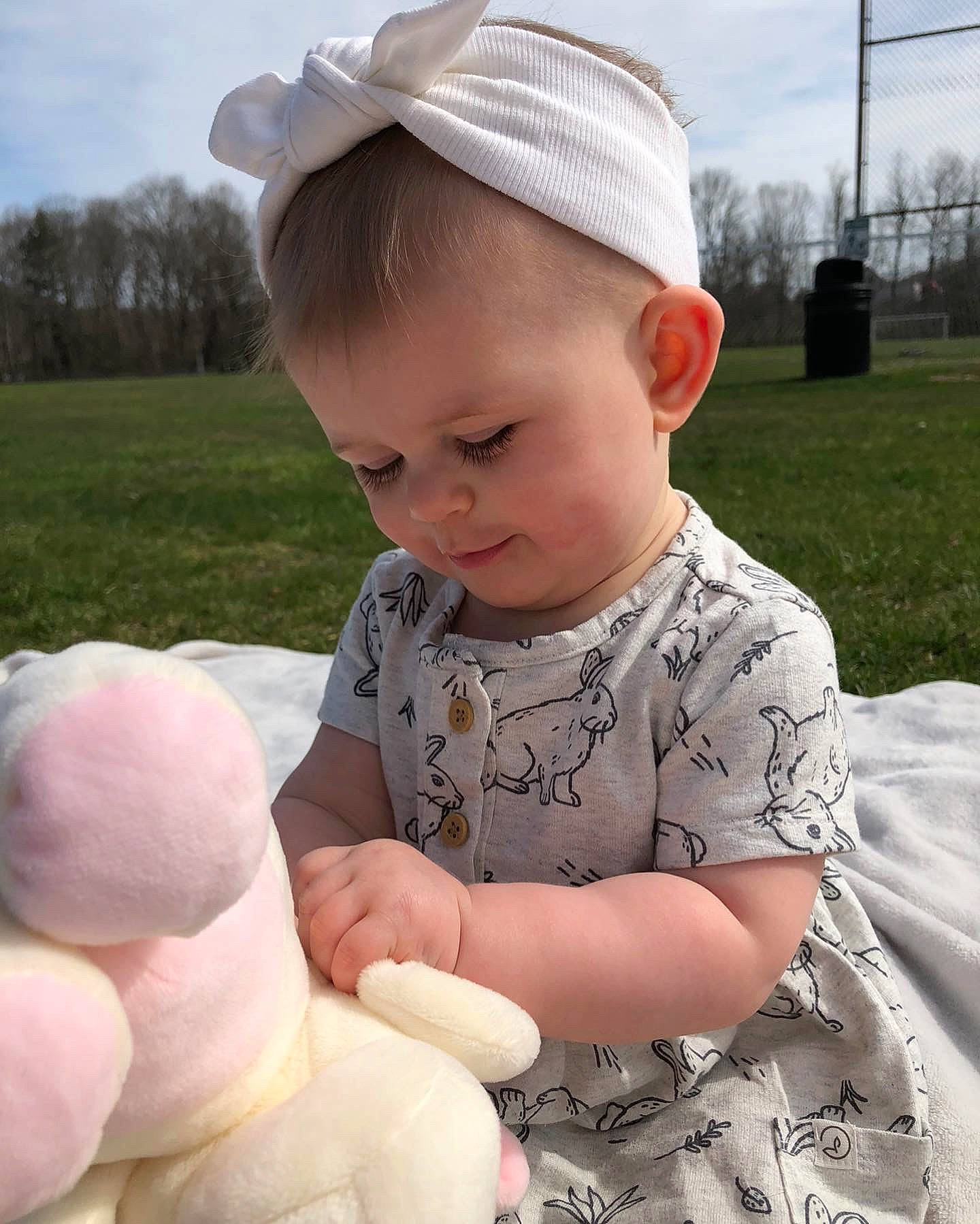 Savanah is registered to the contest to win money with this photo: baby, baby_toddler_clothing, cap, cheek, child, cloud, gesture, grass, hair, happy, hat, head, headgear, person, photograph, plant, skin, sky, sleeve, toddler